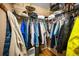 Organized walk-in closet featuring ample hanging space, shelves, and storage containers at 2731 Sherbrooke Ln # D, Palm Harbor, FL 34684