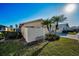Attractive property featuring lush lawn and mature palm trees, providing great curb appeal at 2731 Sherbrooke Ln # D, Palm Harbor, FL 34684