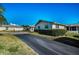 Attractive property showcasing well-maintained landscaping and a long private drive at 2731 Sherbrooke Ln # D, Palm Harbor, FL 34684