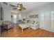 Cozy living room features hardwood floors, shuttered doors, and comfortable seating at 2731 Sherbrooke Ln # D, Palm Harbor, FL 34684
