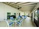 This patio features tables and chairs and a grill for outdoor entertaining at 2731 Sherbrooke Ln # D, Palm Harbor, FL 34684