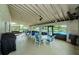 This patio features tables and chairs and a beautiful view of the pool at 2731 Sherbrooke Ln # D, Palm Harbor, FL 34684