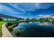 Scenic view of the pond, clubhouse, and reflection of the sky at 2731 Sherbrooke Ln # D, Palm Harbor, FL 34684