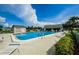 Community pool featuring clear, refreshing water and lounge chairs around the deck at 2731 Sherbrooke Ln # D, Palm Harbor, FL 34684