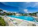 Large community pool featuring lounge chairs for relaxing and clear, inviting water at 2731 Sherbrooke Ln # D, Palm Harbor, FL 34684