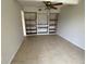Dining area with custom built-ins and tiled flooring at 3223 Coats Rd, Zephyrhills, FL 33541