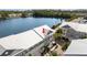 Beautiful waterfront condo with a metal roof and lush landscaping near a tranquil lake at 3226 Nautical S Pl, St Petersburg, FL 33712