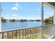 Relaxing balcony view overlooking tranquil lake with lush greenery and residential buildings at 3226 Nautical S Pl, St Petersburg, FL 33712