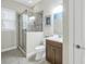 Modern bathroom with a glass-enclosed shower, neutral paint, and updated vanity at 3226 Nautical S Pl, St Petersburg, FL 33712