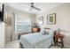 Comfortable bedroom featuring art, a ceiling fan, natural light, and a calm aesthetic at 3226 Nautical S Pl, St Petersburg, FL 33712