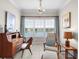 Bedroom featuring a desk, chair, and a picturesque view of the lake at 3226 Nautical S Pl, St Petersburg, FL 33712