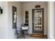 Inviting front porch featuring seating and nautical décor, providing a welcoming entrance to the home at 3226 Nautical S Pl, St Petersburg, FL 33712