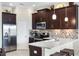 Modern kitchen featuring stainless steel appliances, granite countertops, and ample cabinet space at 3226 Nautical S Pl, St Petersburg, FL 33712