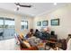Cozy living room showcasing comfortable seating, modern entertainment center, and water views at 3226 Nautical S Pl, St Petersburg, FL 33712