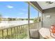 Enjoy the lake view from the screened patio with comfortable seating and lush surroundings at 3226 Nautical S Pl, St Petersburg, FL 33712