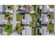 Birds-eye view of property showing the gray roof, mature landscaping, and surrounding neighborhood at 3838 Sablewood Dr, Holiday, FL 34691