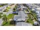 Aerial view of the home showing the backyard, including a covered patio and fenced yard at 3838 Sablewood Dr, Holiday, FL 34691