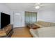 Cozy living room with neutral colored furniture, a ceiling fan, and a television at 3838 Sablewood Dr, Holiday, FL 34691