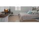 Bedroom with a pull-down murphy bed and attached desk with a large window at 4946 Sapphire Sound Dr, Wimauma, FL 33598