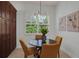 Breakfast nook with large window offering a view of the green outdoors at 4946 Sapphire Sound Dr, Wimauma, FL 33598