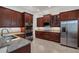 Modern kitchen boasts stainless steel appliances, granite countertops, and ample cabinet space at 4946 Sapphire Sound Dr, Wimauma, FL 33598