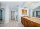 Bathroom featuring granite countertops, tiled floors, and a glass-enclosed shower at 6315 Shoreline Dr # 3305, Madeira Beach, FL 33708