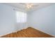 Bedroom with hardwood floors, sheer curtains, and a ceiling fan at 6315 Shoreline Dr # 3305, Madeira Beach, FL 33708