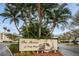 Elegant community sign amid lush landscaping and towering palm trees welcoming residents at 6315 Shoreline Dr # 3305, Madeira Beach, FL 33708