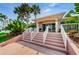 Inviting building entrance featuring well-maintained steps and lush landscaping at 6315 Shoreline Dr # 3305, Madeira Beach, FL 33708