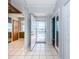 Bright foyer with tile flooring, leading to a view of the balcony and various rooms at 6315 Shoreline Dr # 3305, Madeira Beach, FL 33708