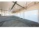 A long shot view of the garage stalls with white garage doors with black hardware at 6315 Shoreline Dr # 3305, Madeira Beach, FL 33708