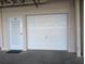 The garage features an exterior door and a classic white door at 6315 Shoreline Dr # 3305, Madeira Beach, FL 33708