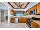Well-equipped kitchen with stainless steel appliances, granite countertops, and ample wooden cabinetry at 6315 Shoreline Dr # 3305, Madeira Beach, FL 33708