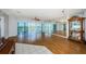 Spacious living room featuring wood floors, large windows, and a mirrored wall at 6315 Shoreline Dr # 3305, Madeira Beach, FL 33708