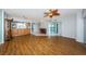 Spacious living room featuring wood floors, kitchen bar, and water views at 6315 Shoreline Dr # 3305, Madeira Beach, FL 33708