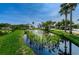 Picturesque community pond surrounded by lush greenery and landscaping at 6315 Shoreline Dr # 3305, Madeira Beach, FL 33708