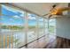 This sun room features beautiful hardwood floors and a stunning lake view through many large windows at 6315 Shoreline Dr # 3305, Madeira Beach, FL 33708