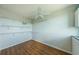 Spacious walk-in closet featuring wood-look floors, built-in shelving, and ample space for organization at 6315 Shoreline Dr # 3305, Madeira Beach, FL 33708
