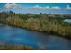 Scenic water view showcasing lush greenery surrounding the tranquil canal at 6315 Shoreline Dr # 3305, Madeira Beach, FL 33708