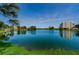 Scenic lake view showcasing the serene surroundings and community buildings at 6315 Shoreline Dr # 3305, Madeira Beach, FL 33708
