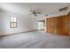 Bedroom with neutral carpeting, double closet, and bright natural light at 7692 Harbor View Way, Seminole, FL 33776