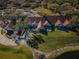 Expansive aerial view of the large clubhouse, beautiful landscaping, and winding paths amidst lush greenery at 9101 Highland Ridge Way, Tampa, FL 33647
