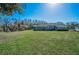 Wide shot of the expansive backyard showing the house at 9101 Highland Ridge Way, Tampa, FL 33647