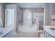Luxurious bathroom featuring a soaking tub, walk-in shower, and modern fixtures at 9101 Highland Ridge Way, Tampa, FL 33647