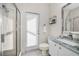 Well-lit bathroom featuring a walk-in shower, a marble vanity and neutral walls at 9101 Highland Ridge Way, Tampa, FL 33647