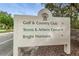 Informative community sign directing to Golf & Country Club, Tennis & Athletic Center, and Bright Horizons at 9101 Highland Ridge Way, Tampa, FL 33647