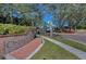 Community entrance with brick signage and wrought iron gate, complemented by lush landscaping at 9101 Highland Ridge Way, Tampa, FL 33647