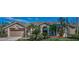Beautiful home featuring lush landscaping, a barrel tile roof, and a two-car garage at 9101 Highland Ridge Way, Tampa, FL 33647