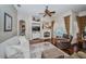 Elegant living room featuring a fireplace, hardwood floors, plush seating, and access to the pool at 9101 Highland Ridge Way, Tampa, FL 33647