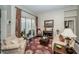 Cozy living room with sliding doors leading to the pool, featuring comfortable seating and stylish decor at 9101 Highland Ridge Way, Tampa, FL 33647